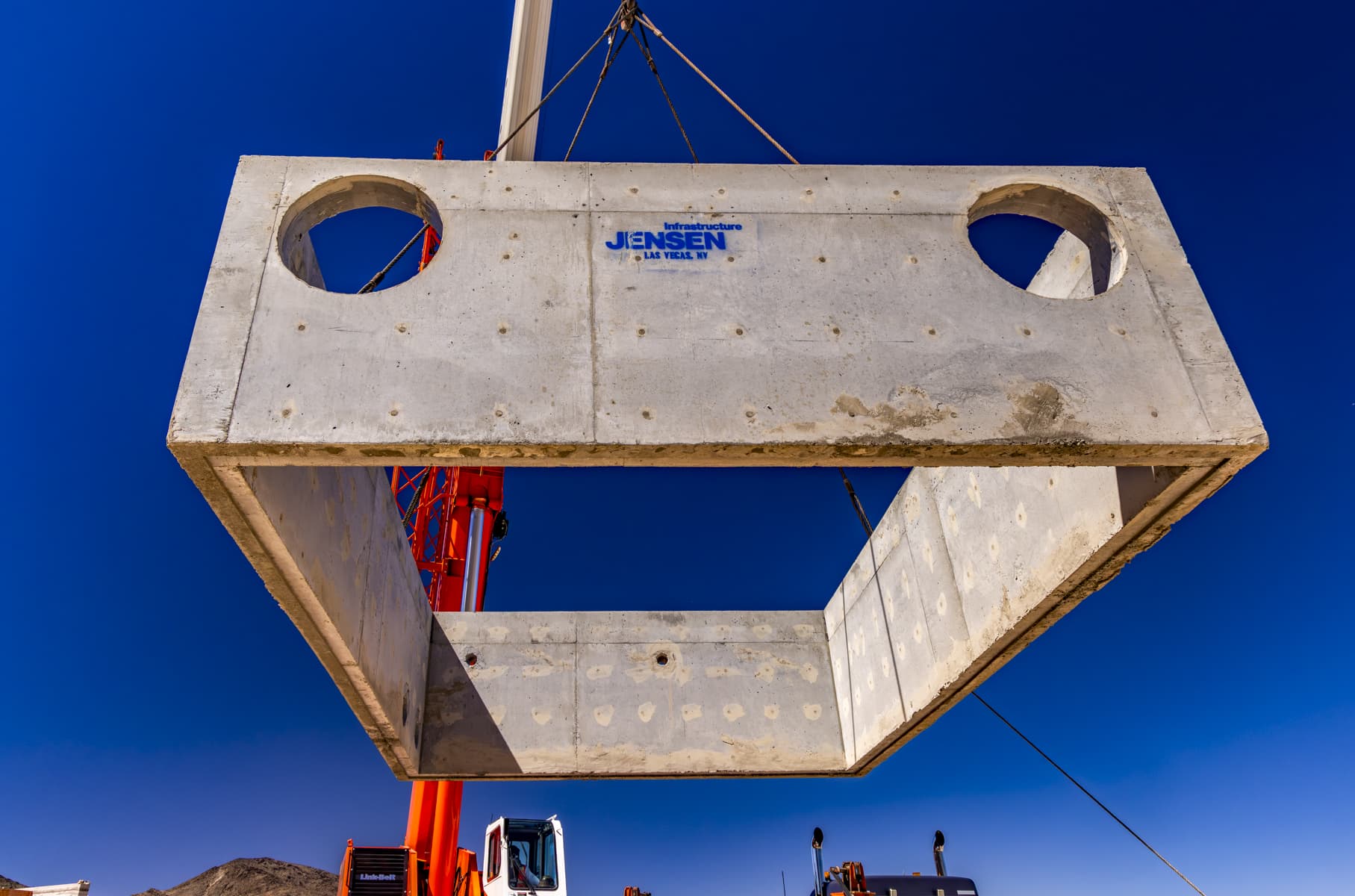 Utility Vault section held up in the air by a crane